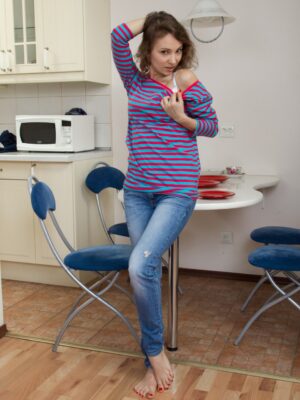 Simona disrobes from jeans denim to relax